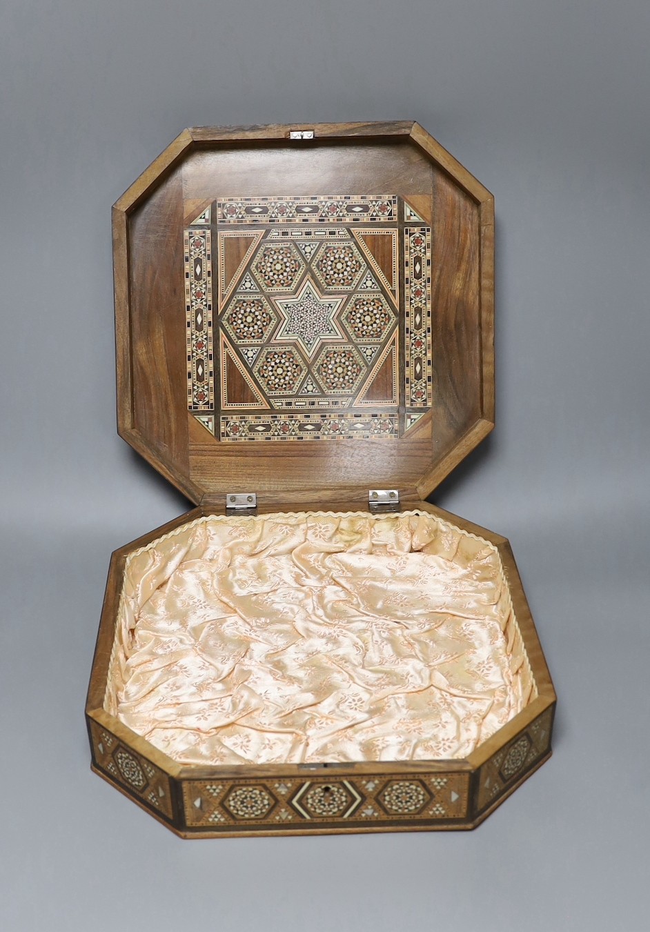 A Moroccan inlaid bone and mother of pearl hexagonal casket, 33 x 33cm